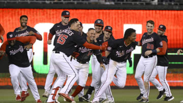 WASHINGTON, DC - SEPTEMBER 28: CJ Abrams #5 of the Washington Nationals celebrates with teammates after driving in the game winning run with a single in the tenth inning against the Atlanta Braves at Nationals Park on September 28, 2022 in Washington, DC. (Photo by Greg Fiume/Getty Images)