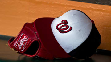 Detailed view of a Rawlings baseball glove and a Washington Nationals hat in the dugout before the game against the San Francisco Giants at AT&T Park on May 21, 2013 in San Francisco, California. The San Francisco Giants defeated the Washington Nationals 4-2 in 10 innings. (Photo by Jason O. Watson/Getty Images)