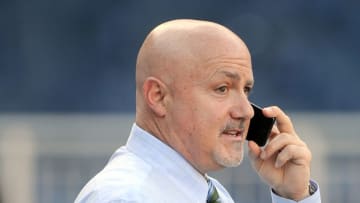 WASHINGTON, DC - SEPTEMBER 23: General Manager Mike Rizzo of the Washington Nationals talks on the phone before the game against the New York Mets at Nationals Park on September 23, 2014 in Washington, DC. (Photo by G Fiume/Getty Images)
