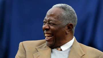Hall of Famer Hank Aaron enjoys a laugh as he is honored on the 40th anniversary of his 715th homer prior to the game between the Atlanta Braves and the New York Mets at Turner Field on April 8, 2014 in Atlanta, Georgia. (Photo by Kevin C. Cox/Getty Images)