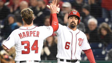 WASHINGTON, DC - APRIL 09: Bryce Harper #34 and Anthony Rendon #6 celebrate scoring on a Howie Kendrick #12 double in the first inning of the Washington Nationals during a baseball game against the Atlanta Braves at Nationals Park on April 9, 2018 in Washington, DC. (Photo by Mitchell Layton/Getty Images)