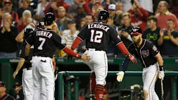 WASHINGTON, DC - APRIL 27: Howie Kendrick #12 of the Washington Nationals celebrates with Trea Turner #7 and Bryce Harper #34 after hitting a two-run home run in the third inning against the Arizona Diamondbacks at Nationals Park on April 27, 2018 in Washington, DC. (Photo by Patrick McDermott/Getty Images)