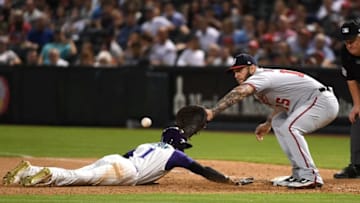 PHOENIX, AZ - MAY 10: Jarrod Dyson #1 of the of the Arizona Diamondbacks safely dives back to first base as Matt Adams #15 of the Washington Nationals waits for the throw from the pitchers mound during the tenth inning at Chase Field on May 10, 2018 in Phoenix, Arizona. Nationals win 2-1 in ten innings. (Photo by Norm Hall/Getty Images)