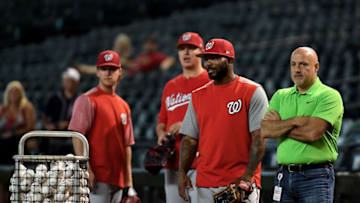 PHOENIX, AZ - MAY 11: Howie Kendrick #12 and general manager Mike Rizzo of the Washington Nationals look on during batting practice prior to the MLB game against the Arizona Diamondbacks at Chase Field on May 11, 2018 in Phoenix, Arizona. (Photo by Jennifer Stewart/Getty Images)