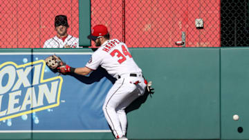 WASHINGTON, DC - MAY 23: Bryce Harper #34 of the Washington Nationals can't reach a ball hit by Christian Villanueva #22 of the San Diego Padres (not pictured) for a two RBI double in the sixth inning at Nationals Park on May 23, 2018 in Washington, DC. (Photo by Rob Carr/Getty Images)
