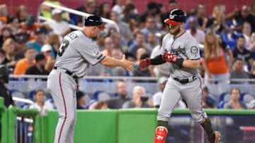MIAMI, FL - MAY 27: Bryce Harper #34 of the Washington Nationals is congratulated by Third Base Coach Bob Henley #13 after hitting a home run in the sixth inning against the Miami Marlins at Marlins Park on May 27, 2018 in Miami, Florida. (Photo by Eric Espada/Getty Images)