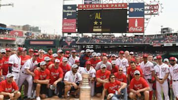 WASHINGTON, DC - JUNE 09: The Washington Nationals pose with the Washington Capitals and the Stanley Cup, as the Caps are honored before a baseball game against the San Francisco Giants at Nationals Park on June 9, 2018 in Washington, DC. (Photo by Mitchell Layton/Getty Images)