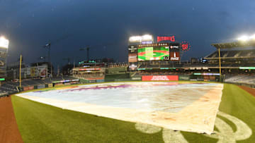 WASHINGTON, DC - JUNE 20: The tarp covers the field as the game into a rain daly after the fourth inning during a baseball game between the Washington Nationals and the Baltimore Orioles at Nationals Park on June 20, 2018 in Washington, DC. (Photo by Mitchell Layton/Getty Images)