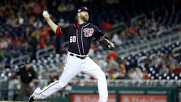 WASHINGTON, DC - JUNE 22 : Justin Miller #60 of the Washington Nationals throws to a Philadelphia Phillies batter at Nationals Park on June 22, 2018 in Washington, DC. (Photo by Rob Carr/Getty Images)