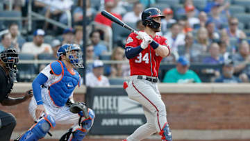 NEW YORK, NY - JULY 14: Bryce Harper #34 of the Washington Nationals follows through on a sixth inning RBI single against the New York Mets at Citi Field on July 14, 2018 in the Flushing neighborhood of the Queens borough of New York City. (Photo by Jim McIsaac/Getty Images)