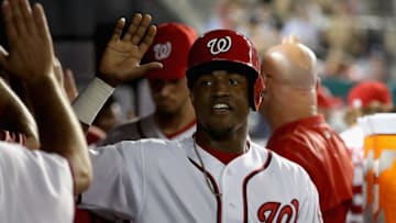 WASHINGTON, DC - SEPTEMBER 14: Victor Robles #14 of the Washington Nationals celebrates in the dugout after scoring in the sixth inning against the Atlanta Braves at Nationals Park on September 14, 2017 in Washington, DC. (Photo by Rob Carr/Getty Images)