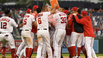 WASHINGTON, DC - MAY 06: The Washington Nationals celebrate Wilmer Difo #1 game winning base hit in the ninth inning during a baseball game against the Philadelphia Phillies at Nationals Park on May 6, 2018 in Washington, DC. (Photo by Mitchell Layton/Getty Images)