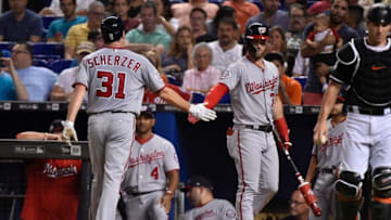 MIAMI, FL - JULY 27: Bryce Harper #34 of the Washington Nationals congratulates Max Scherzer #31 after scoring on a wild pitch during the third inning against the Miami Marlins at Marlins Park on July 27, 2018 in Miami, Florida. (Photo by Eric Espada/Getty Images)