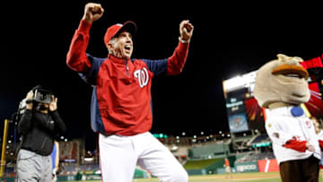 WASHINGTON, DC - SEPTEMBER 22: Manager Davey Johnson of the Washington Nationals reacts with fans after his team's walk-off 5-4 win over the Miami Marlins in the ninth inning of game 2 of their day-night doubleheader at Nationals Park on September 22, 2013 in Washington, DC. The game was Johnson's last regular-season home game managing the team. (Photo by Jonathan Ernst/Getty Images)