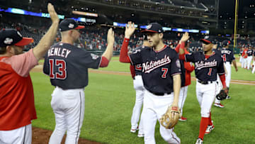 WASHINGTON, DC - SEPTEMBER 25: Trea Turner #7 of the Washington Nationals and Wilmer Difo #1 celebrate following the Nationals 9-4 win over the Miami Marlins at Nationals Park on September 25, 2018 in Washington, DC. (Photo by Rob Carr/Getty Images)