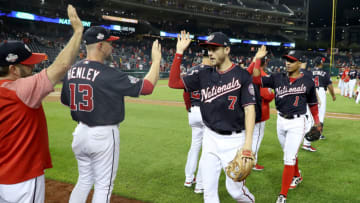 WASHINGTON, DC - SEPTEMBER 25: Trea Turner #7 of the Washington Nationals and Wilmer Difo #1 celebrate following the Nationals 9-4 win over the Miami Marlins at Nationals Park on September 25, 2018 in Washington, DC. (Photo by Rob Carr/Getty Images)