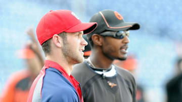 WASHINGTON, DC - MAY 19: Bryce Harper #34 of the Washington Nationals talks with Adam Jones #10 of the Baltimore Orioles before the game at Nationals Park on May 19, 2012 in Washington, DC. (Photo by Greg Fiume/Getty Images)