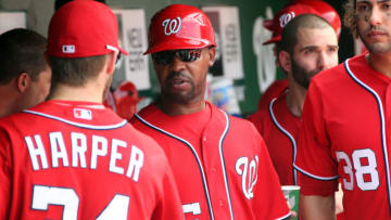 WASHINGTON, DC - SEPTEMBER 8: Bryce Harper #34 of the Washington Nationals speaks with assistant coach Bo Porter #16 in the dugout against the Miami Marlins at Nationals Park on September 8, 2012 in Washington, DC. The Nationals won 7-6. (Photo by Ned Dishman/Getty Images)