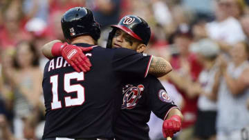WASHINGTON, DC - AUGUST 12: Matt Adams #15 of the Washington Nationals hugs Gerardo Parra #88 after hitting a two-run home run in the first inning against the Cincinnati Reds at Nationals Park on August 12, 2019 in Washington, DC. (Photo by Patrick McDermott/Getty Images)