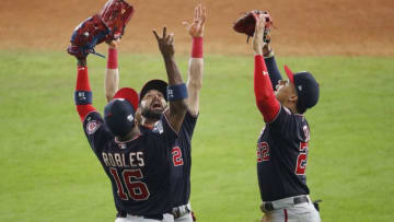 HOUSTON, TEXAS - OCTOBER 22: Juan Soto #22, Victor Robles #16 and Adam Eaton #2 of the Washington Nationals celebrate their teams 5-4 win over the Houston Astros in Game One of the 2019 World Series at Minute Maid Park on October 22, 2019 in Houston, Texas. (Photo by Tim Warner/Getty Images)