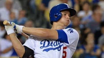 Sep 18, 2015; Los Angeles, CA, USA; Los Angeles Dodgers shortstop Corey Seager (5) hits a 2 run home run the fourth inning of the game against the Pittsburgh Pirates at Dodger Stadium. Mandatory Credit: Jayne Kamin-Oncea-USA TODAY Sports