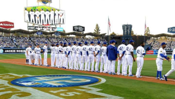 Apr 15, 2015; Los Angeles, CA, USA; Los Angeles Dodgers line up for the national anthem to commemorate Jackie Robinson Day before the game against the Seattle Mariners at Dodger Stadium. Mandatory Credit: Jayne Kamin-Oncea-USA TODAY Sports