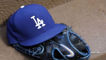 Aug 12, 2014; Atlanta, GA, USA; Detailed view of Los Angeles Dodgers hat and glove in the dugout against the Atlanta Braves in the third inning at Turner Field. Mandatory Credit: Brett Davis-USA TODAY Sports