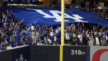 Sep 12, 2016; Bronx, NY, USA; Los Angeles Dodgers fans raise a banner behind the left field foul pole during the third inning against the New York Yankees at Yankee Stadium. Mandatory Credit: Brad Penner-USA TODAY Sports