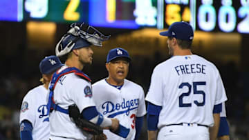 LOS ANGELES, CA - SEPTEMBER 21: Manager Dave Roberts #30 waits on the mound with Justin Turner #10 Yasmani Grandal #9 and David Freese #25 of the Los Angeles Dodgers during a pitching change in the fifth inning against the San Diego Padres at Dodger Stadium on September 2, 2018 in Los Angeles, California. (Photo by Jayne Kamin-Oncea/Getty Images)
