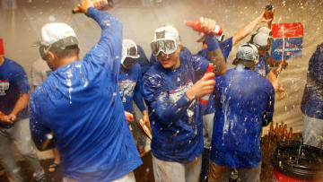 SAN FRANCISCO, CA - SEPTEMBER 29: Manny Machado (center) #8 of the Los Angeles Dodgers celebrates with teammates after the Dodgers clinched a postseason spot by defeating the San Francisco Giants at AT&T Park on September 29, 2018 in San Francisco, California. (Photo by Lachlan Cunningham/Getty Images)