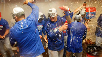 SAN FRANCISCO, CA - SEPTEMBER 29: Manny Machado (center) #8 of the Los Angeles Dodgers celebrates with teammates after the Dodgers clinched a postseason spot by defeating the San Francisco Giants at AT&T Park on September 29, 2018 in San Francisco, California. (Photo by Lachlan Cunningham/Getty Images)