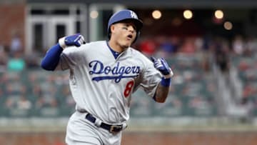 ATLANTA, GA - OCTOBER 08: Manny Machado #8 of the Los Angeles Dodgers celebrates as he rounds the bases after hitting a three run homerun during the seventh inning of Game Four of the National League Division Series against the Atlanta Braves at Turner Field on October 8, 2018 in Atlanta, Georgia. (Photo by Rob Carr/Getty Images)