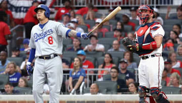 ATLANTA, GA - OCTOBER 08: Manny Machado #8 of the Los Angeles Dodgers watches his three run homerun next to catcher Tyler Flowers #25 of the Atlanta Braves during the seventh inning of Game Four of the National League Division Series at Turner Field on October 8, 2018 in Atlanta, Georgia. (Photo by Rob Carr/Getty Images)