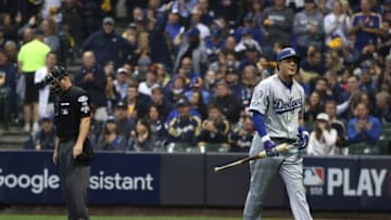 MILWAUKEE, WI - OCTOBER 12: Manny Machado #8 of the Los Angeles Dodgers reacts after striking out against the Milwaukee Brewers during the fourth inning in Game One of the National League Championship Series at Miller Park on October 12, 2018 in Milwaukee, Wisconsin. (Photo by Rob Carr/Getty Images)