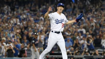 LOS ANGELES, CA - OCTOBER 26: Walker Buehler #21 of the Los Angeles Dodgers reacts after retiring the side on a strike out during the seventh inning against the Boston Red Sox in Game Three of the 2018 World Series at Dodger Stadium on October 26, 2018 in Los Angeles, California. (Photo by Harry How/Getty Images)