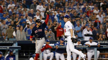 LOS ANGELES, CA - OCTOBER 27: Mookie Betts #50 of the Boston Red Sox crosses home plate to score in the ninth inning as Kenta Maeda #18 of the Los Angeles Dodgers look on during Game Four of the 2018 World Series at Dodger Stadium on October 27, 2018 in Los Angeles, California. (Photo by Sean M. Haffey/Getty Images)