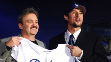 Los Angeles Dodgers general manager Ned Colletti (left) and Nomar Garciaparra pose at press conference to announce signing of Garciaparra to a one-year contract at Dodger Stadium in Los Angeles, Calif. on Monday, December 19, 2005. (Photo by Kirby Lee/Getty Images)