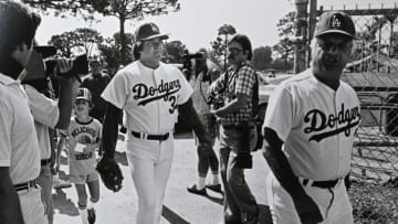 VERO BEACH, FL - FEBRUARY 15, 1981: Manager Tommy Lasorda #2 clears the way for pitcher Fernando Valenzuela #34 of the Los Angeles Dodgers during spring training at Dodgertown in Vero Beach, Florida. (Photo by Jayne Kamin-Oncea/Getty Images)