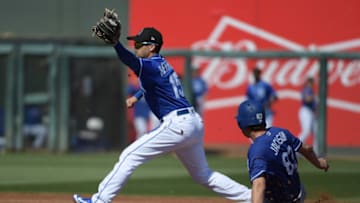 SURPRISE, AZ - FEBRUARY 24: Whit Merrifield #15 of the Kansas City Royals makes the out at second on the sliding Drew Jackson #83 of the Los Angeles Dodgers at Surprise Stadium on February 24, 2018 in Surprise, Arizona. (Photo by Jennifer Stewart/Getty Images)