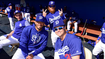 GLENDALE, AZ - MARCH 01: Edwin Rios #78 and Joc Pederson #31 of the Los Angeles Dodgers pose for a photo as Justin Turner #10 photobombs in the background before the spring training game against the Cleveland Indians at Camelback Ranch on March 1, 2018 in Glendale, Arizona. (Photo by Jennifer Stewart/Getty Images)