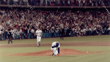 LOS ANGELES - OCTOBER 12: Orel Hershiser #53 of the Los Angeles Dodgers kneels on the mound following the final out of Game Seven of the 1988 National League Championship Series against the New York Mets at Dodger Stadium on October 12, 1988 in Los Angeles, California. (Photo by Robert Riger/Getty Images)