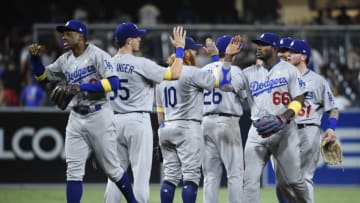 SAN DIEGO, CA - SEPTEMBER 1: Los Angeles Dodgers players high five after beating the San Diego Padres 1-0 in a baseball game at PETCO Park on September 1, 2017 in San Diego, California. (Photo by Denis Poroy/Getty Images)