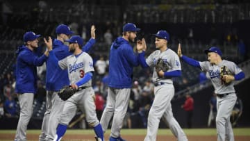 SAN DIEGO, CA - APRIL 18: Los Angeles Dodgers players high-five after a win over the San Diego Padres 13-4 in a baseball game at PETCO Park on April 18, 2018 in San Diego, California. (Photo by Denis Poroy/Getty Images)