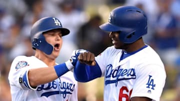 LOS ANGELES, CA - JUNE 12: Joc Pederson #31 of the Los Angeles Dodgers celebrates his two run homerun with Yasiel Puig #66 to take a 3-0 lead over the Texas Rangers during the second inning at Dodger Stadium on June 12, 2018 in Los Angeles, California. (Photo by Harry How/Getty Images)