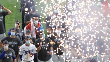 ARLINGTON, TEXAS - OCTOBER 27: The Los Angeles Dodgers react during the Commissioner's Trophy presentation ceremony after defeating the Tampa Bay Rays 3-1 in Game Six to win the 2020 MLB World Series at Globe Life Field on October 27, 2020 in Arlington, Texas. (Photo by Sean M. Haffey/Getty Images)