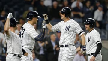 NEW YORK, NEW YORK - SEPTEMBER 19: (NEW YORK DAILIES OUT) DJ LeMahieu #26 of the New York Yankees celebrates against the Los Angeles Angels of Anaheim with teammates Brett Gardner #11 (L), Giancarlo Stanton #27 and Austin Romine #28 (R) at Yankee Stadium on September 19, 2019 in New York City. The Yankees defeated the Angels 9-1 to clinch the American League East division. (Photo by Jim McIsaac/Getty Images)