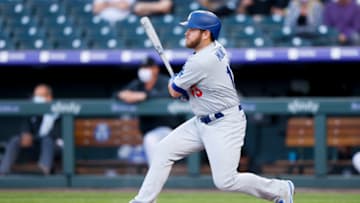 DENVER, CO - APRIL 2: Max Muncy #13 of the Los Angeles Dodgers watches his RBI single during the first inning against the Colorado Rockies at Coors Field on April 2, 2021 in Denver, Colorado. The Rockies defeated the Dodgers 8-5. (Photo by Justin Edmonds/Getty Images)