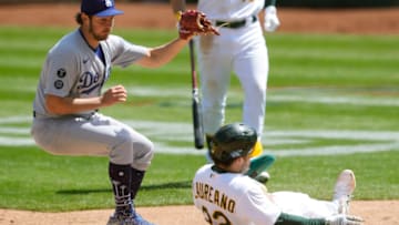 OAKLAND, CALIFORNIA - APRIL 07: Ramon Laureano #22 of the Oakland Athletics scores on a wild pitch by Trevor Bauer #27 of the Los Angeles Dodgers in the fourth inning at RingCentral Coliseum on April 07, 2021 in Oakland, California. (Photo by Thearon W. Henderson/Getty Images)