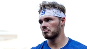 LOS ANGELES, CALIFORNIA - AUGUST 17: Gavin Lux #9 of the Los Angeles Dodgers reacts during an interview prior to a game against the Pittsburgh Pirates at Dodger Stadium on August 17, 2021 in Los Angeles, California. (Photo by Michael Owens/Getty Images)