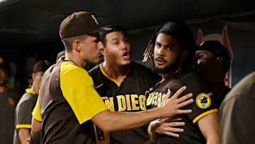 ST LOUIS, MO - SEPTEMBER 18: Manny Machado #13 and Fernando Tatis Jr. #23 of the San Diego Padres exchange words in the dugout during the fifth inning against the St. Louis Cardinals at Busch Stadium on September 18, 2021 in St Louis, Missouri. (Photo by Jeff Curry/Getty Images)